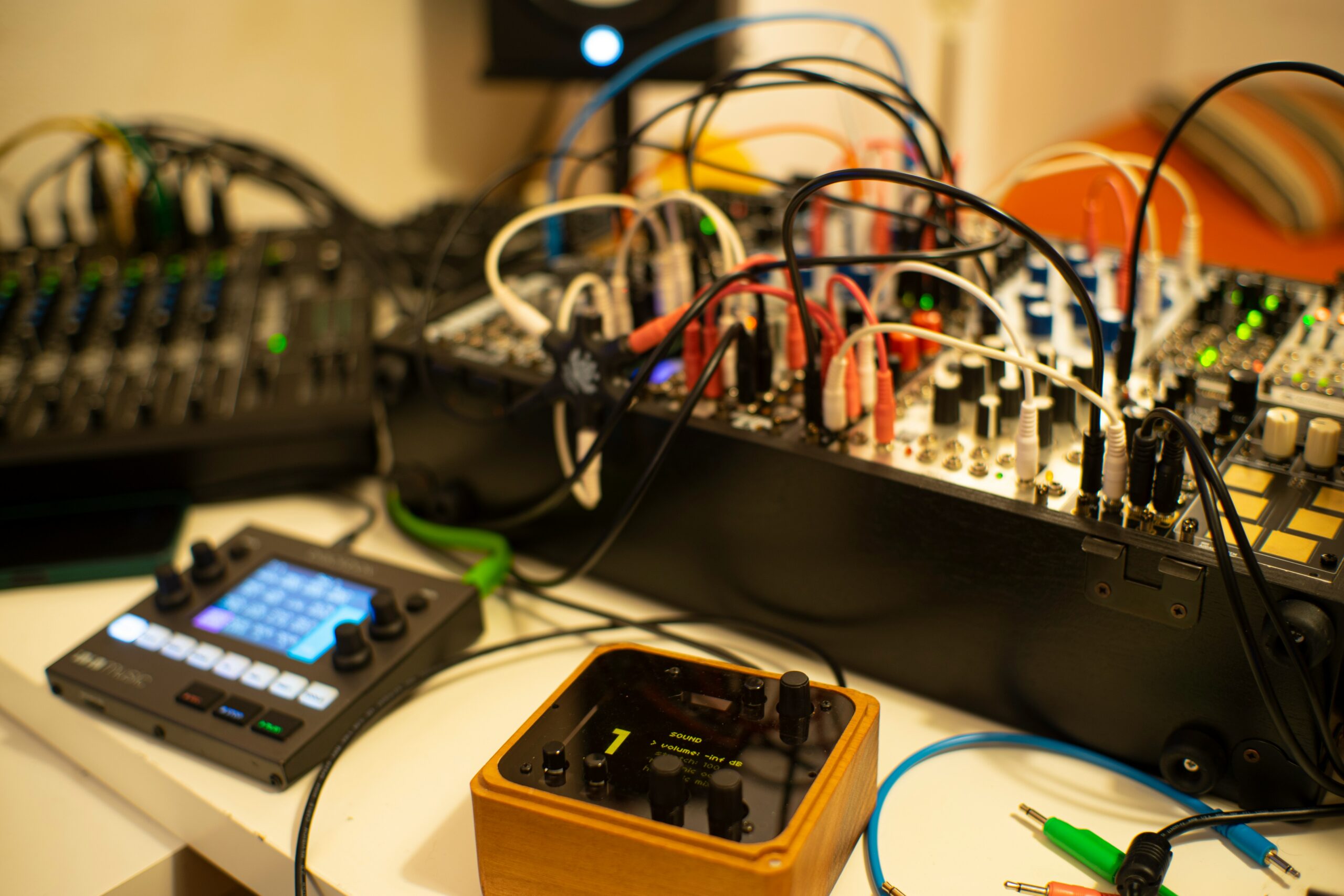 A table topped with electronic equipment and wires